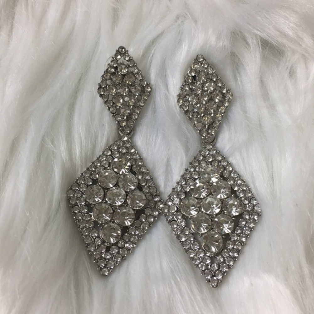 Silver-tone, sparkling stones, dangling earrings.